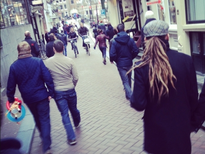 i wonder what�s that guy on the left carrying on his hand apart from the giraaf...